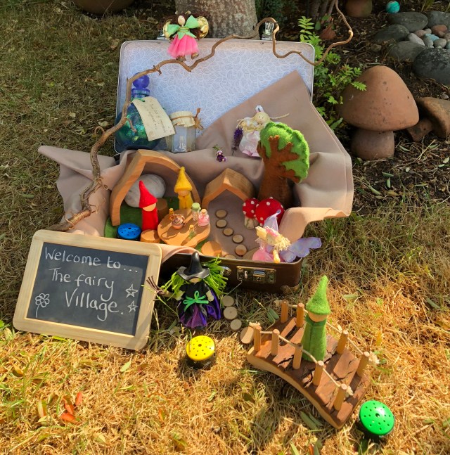 Inspiring Suitcases filled with exciting treasures to explore - a fairy village