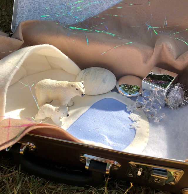 Inspiring Suitcases filled with exciting treasures to explore - winter scene