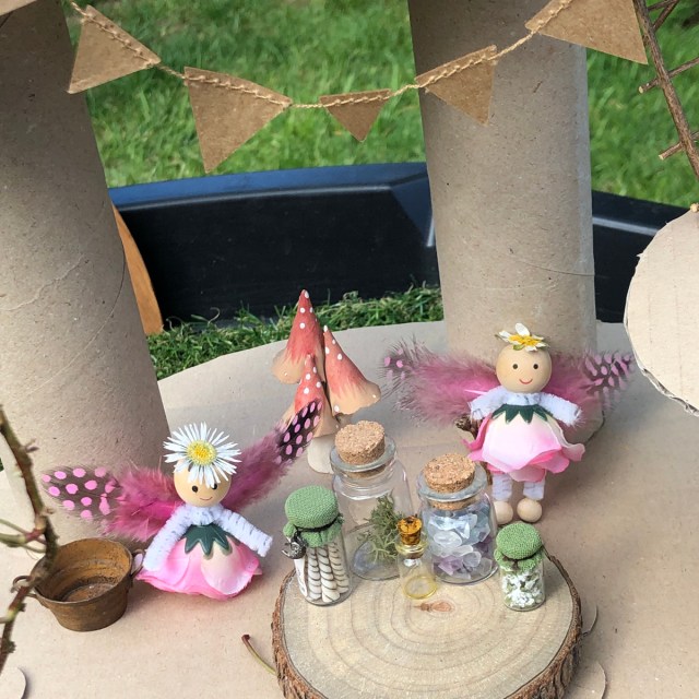 Fairy Small World Play in the Tuff Tray idea. With miniature fairies and potion bottles.