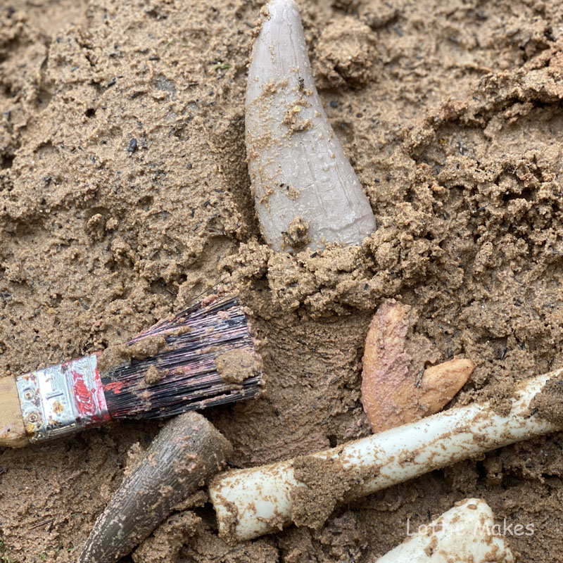 Digging for fossils and bones in sand