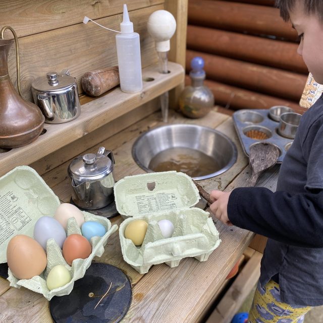 Sorting mud kitchen ingredients - eggs by size